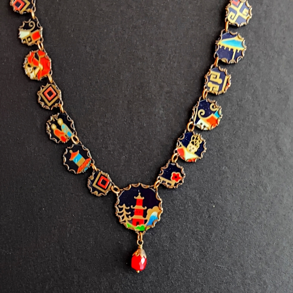 CHINEESE UNIQUE necklace.  Unable to find another.  15 charms. One beutyful beed